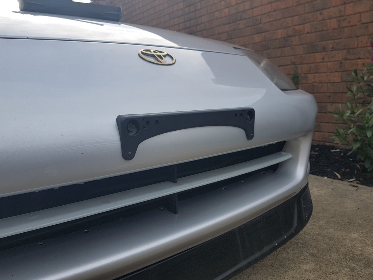 Genuine UK Spec Front Number Plate Garnish JZA80 - DNST Motorsports