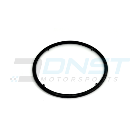 a round rubber gasket with 4 rubber prongs on a white background with DNST Motorsports watermark