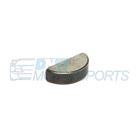 A half moon metallic object on a white background with DNST Motorsports watermark