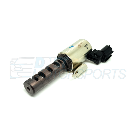 a metal solenoid with black connector on a white background with a DNST Motorsports watermark