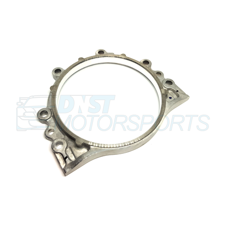a metal bracket engine part on a white background with a DNST Motorsports watermark