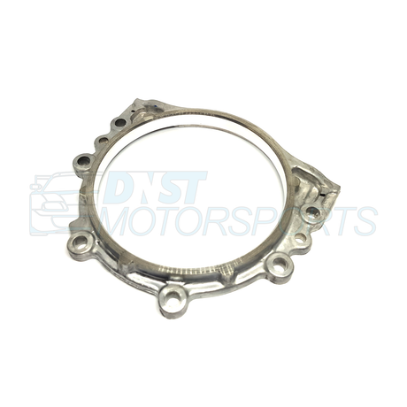a metal bracket engine part on a white background with a DNST Motorsports watermark